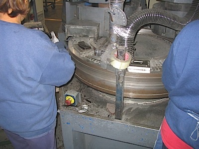 19. Now the manufacturer will cut chamfers and slots into the pads. Also, the pad will be ground to the correct height.