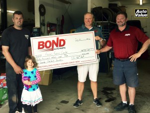 From left to right: Aaron Belanger (owner Aaron’s Repair Center), Aaron’s daughter, Mark Mast (VP of Marketing Bond Auto Parts) and Patrick Marshesseault (Regional Mgr. Bond Auto Parts).